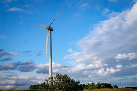 Premium Photo Wind Power Turbines For Electric Power Generation In Landscape With Green Grass