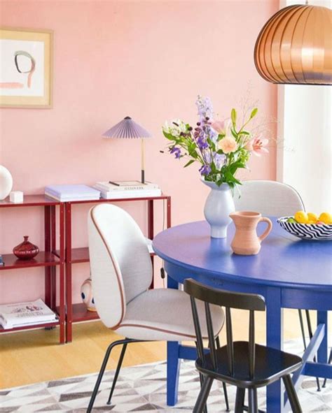 Pastel Infused Danish Dining Room With Pink Walls And Blue Table