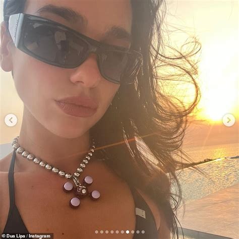 Dua Lipa Flaunts Her Sensational Figure In TINY Orange Bikini As She Enjoys Some Downtime On The