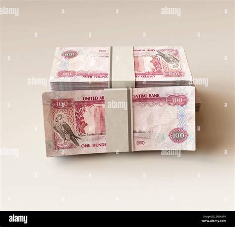 A Stack Of Bundled Uae Dirham Banknotes On An Isolated Light Background