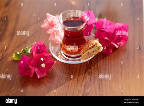 Turkish Delight And Traditional Glass Of Turkish Tea With Bougainvillea