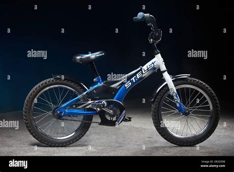 Blue used children bicycle Stels Pilot 170 16 inch tires in dark room ...