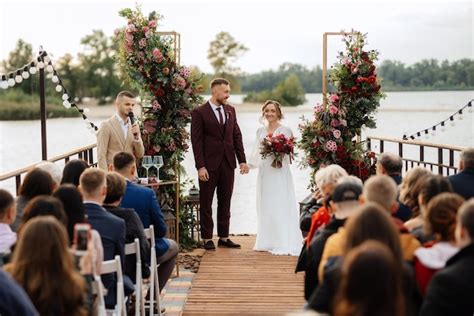 Premium Photo | Wedding ceremony of the newlyweds on the pier