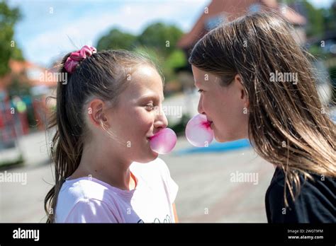 Young Group Of Girl With Bubble Gum Blowing Bubbles Stock Photo Alamy