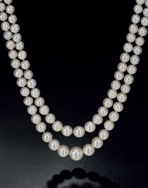 An Exceptional Two Strand Natural Pearl And Diamond Necklace Alain R