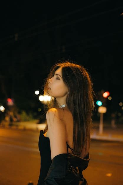 Cute Brunette Posing On A City Street Premium Photo