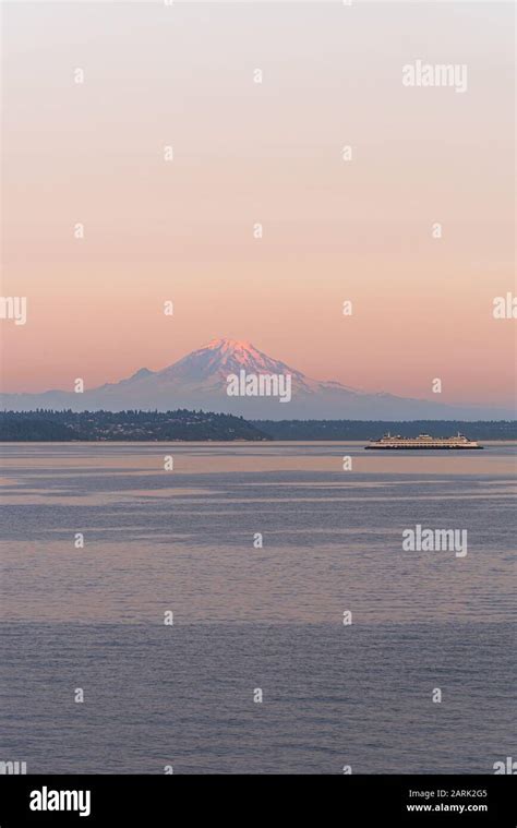 Washington State Ferry Crossing Puget Sound At Twilight With Mt Rainier