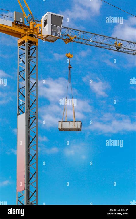 Construction Tower Crane Against The Blue Sky Stock Photo Alamy