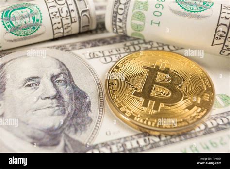 Bitcoin Coin And Banknotes Of One Hundred Dollar Conceptual Image For