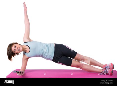 Pretty Brunette Looking At Camera And Doing Side Plank On Exercise Mat