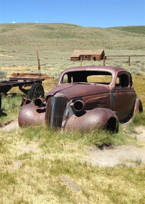 vintage car rusting in a field. | Abandoned cars, Barn find cars, Rusty