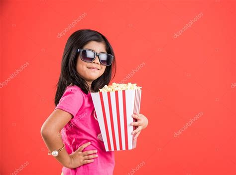 Happy Girl Eating Popcorn And Wearing Glasses Indian Girl Eating