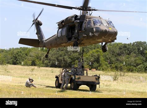 Us Soldiers Hook A Cargo Hook Release Pendant To A Uh 60 Black Hawk