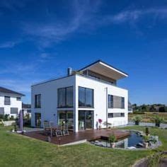 Шикарный современный немецкий дом | homify | Betonhäuser, Haus hanglage ...