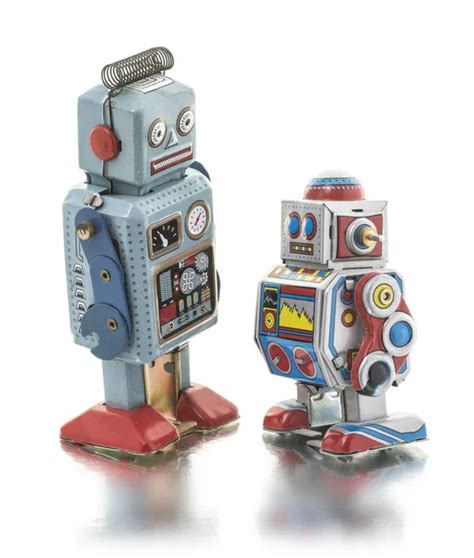 Collection Of Retro Tin Clockwork Robots On A White Background Stock