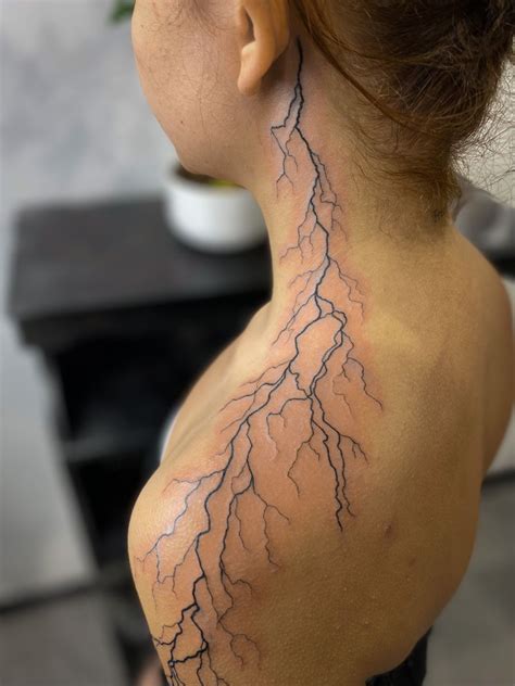 Lightning Tattoo On Womans Neck