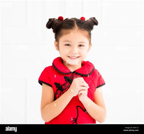 Chinese Little Girl With Congratulation Gesture Stock Photo Alamy