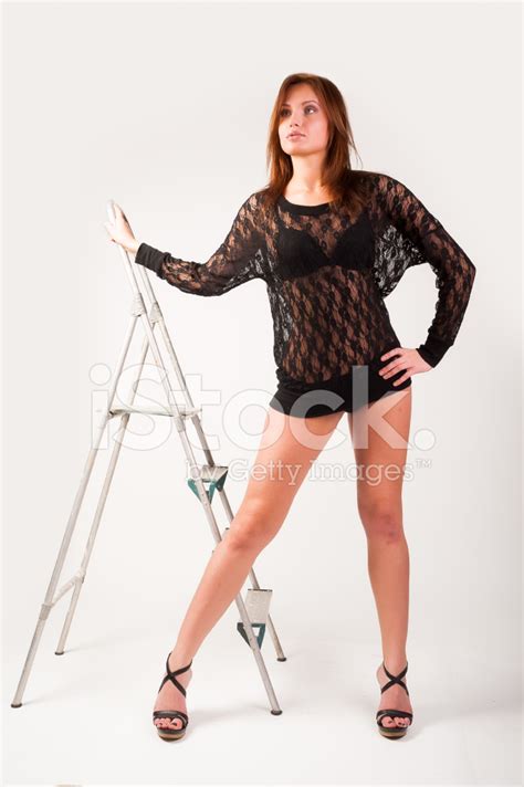 Pretty Brunette Girl Standing At Ladder Stock Photo Royalty Free Freeimages