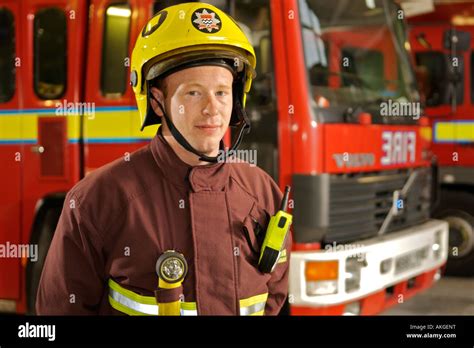 portrait  london fire brigade fireman  front  fire trucks stock