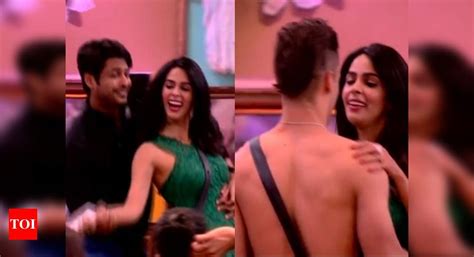 Bigg Boss 13 Mallika Sherawat Sits On Sidharth Shuklas Lap Gets