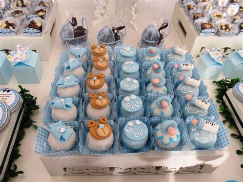 A Table Topped With Lots Of Cakes And Cupcakes