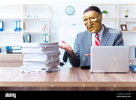 The Businessman Wearing Mask In Hypocrisy Concept Stock Photo Alamy