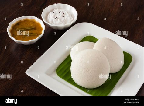 Fresh Steamed Indian Idly Idli Rice Cake Arranged On Banana Leaf