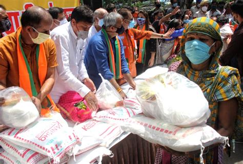 New Delhi Sex Workers Stand In A Queue During The Delhi BJP President Adesh Gupta With