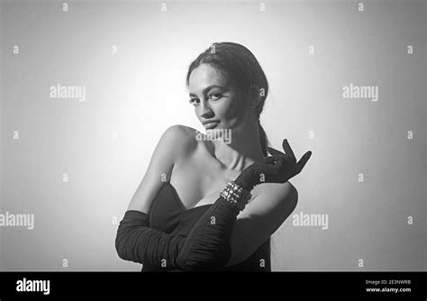 Sexy Brunette Woman In Black Dress And Gloves Big Boobs Stock Photo