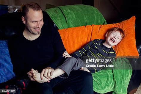 guy feet tickled stock  high res pictures  images getty