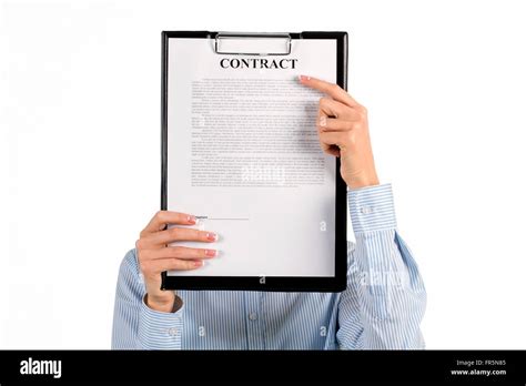 Secretary hiding face behind clipboard Stock Photo - Alamy