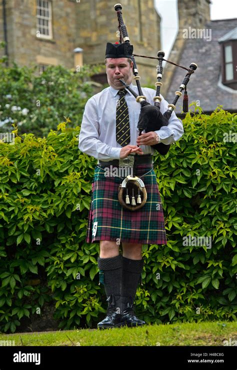 Solo Bagpiper Playing Bagpipes In Kilt Bagpiper Music Competition