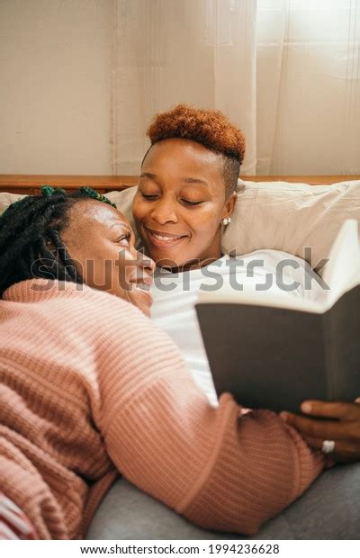 Happy Lesbian Couple Cuddling Reading Book Stock Photo 1994236628 Shutterstock