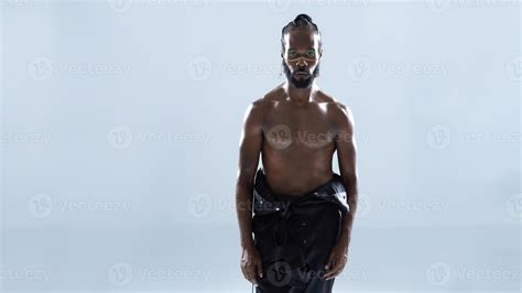 Shirtless African American Gay Man With Bright Makeup Looking At Camera Stock Photo At