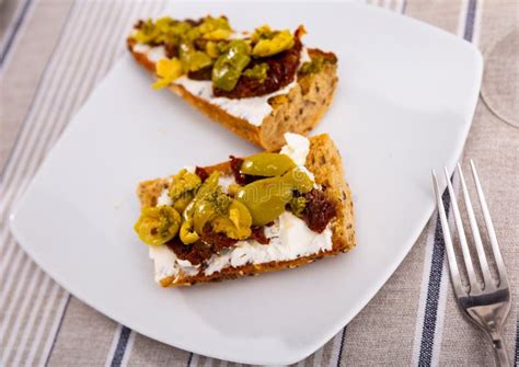 Toasted Sandwiches With Cream Cheese Sun Dried Tomatoes And Olives