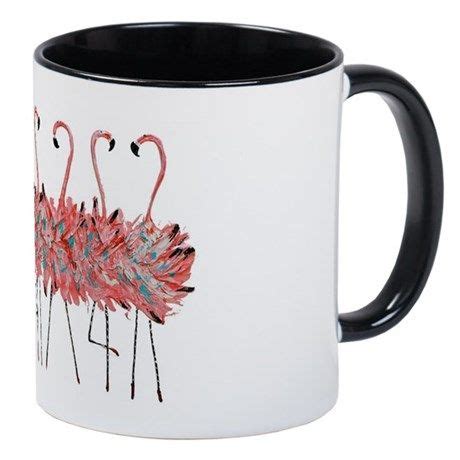 A White And Black Coffee Mug With Pink Flamingos On The Inside One Has