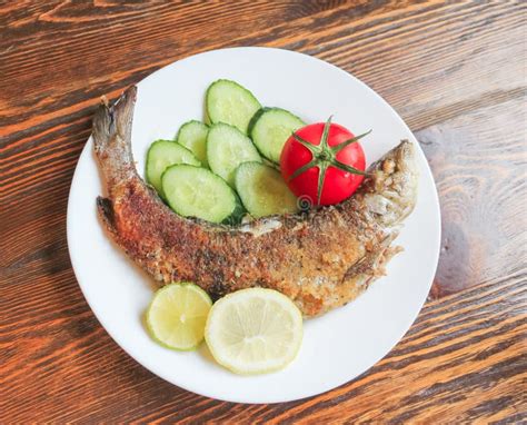 Fried Fish With Vegetables. Wild Grayling Fried In Breadcrumbs, Stock Photo - Image of cook ...