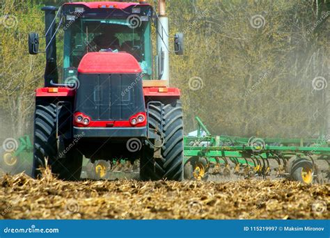 Farmer In Tractor Preparing Land With Seedbed Cultivator Stock Image