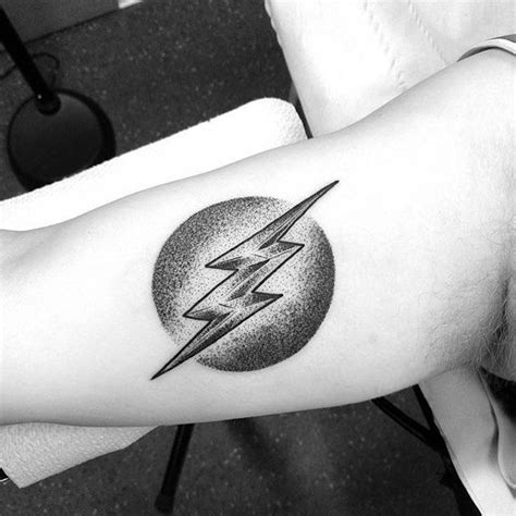 Lightning bolt tattoo on the arm Dot-work style tattoo of a lightning ...