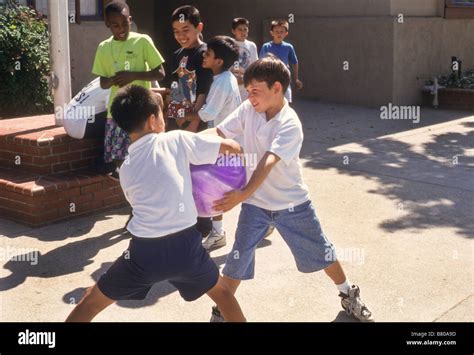 Children Fighting On Playground