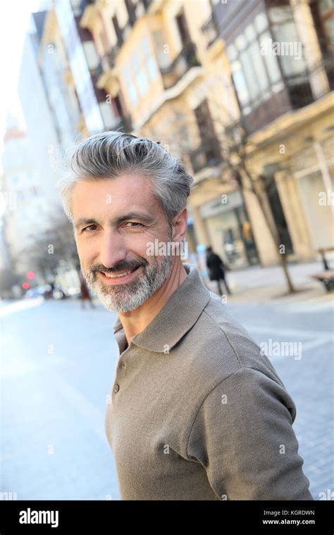Handsome Mature Man Standing In The Street Stock Photo Alamy