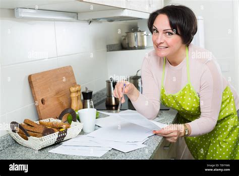 Happy Brunette Woman Applying For Bank Loan At Kitchen Stock Photo Alamy