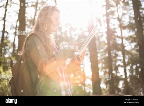 Pretty Blonde Hiker Reading Map Stock Photo Alamy