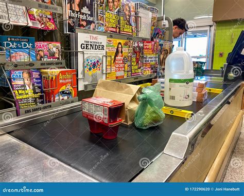 A Checkout Counter with Food on the Counter of Publix Grocery Store ...