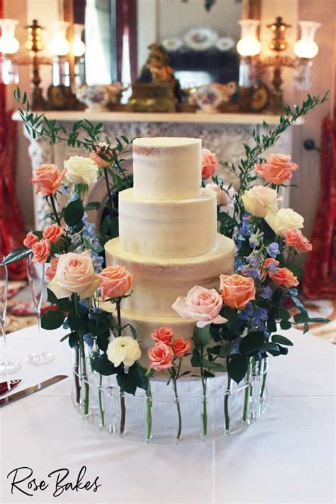 Barely Naked Wedding Cake With Floral Crown Cake Stand