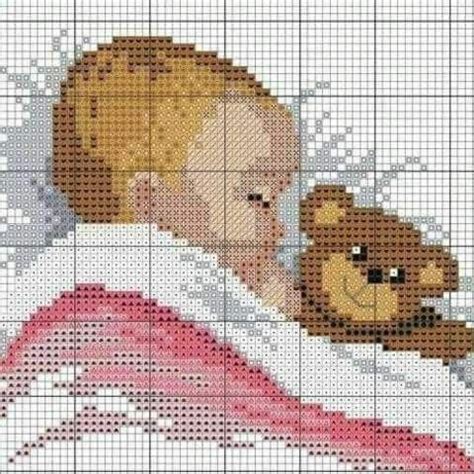 A Cross Stitch Pattern With A Teddy Bear Hugging A Girl