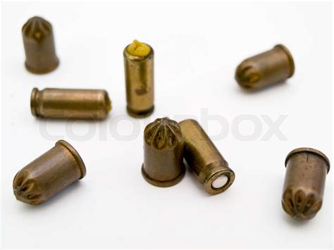 scattered metal bullets   white table stock image colourbox