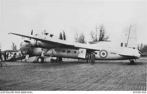 An RNZAF Bristol Freighter Aircraft NZ902 Unloading Vehicles And