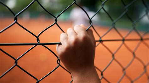 Child Watching Tennis Match Through Fence 3 Stock Footage Sbv 348848166