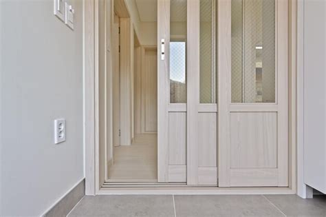 Premium Photo The Front Door Decorated In Nude Tones Gives The House A Warm Interior Feel